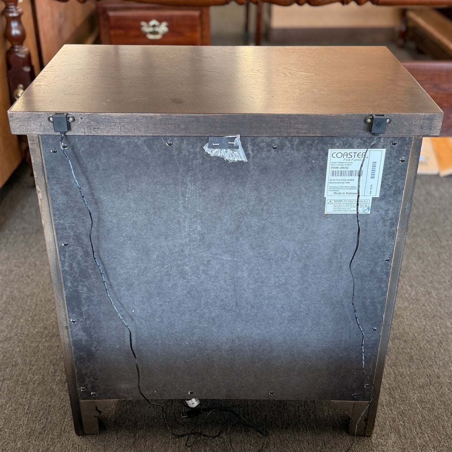 A modern dark-wood queen platform bed frame with a horizontal-paneled headboard, six footboard storage drawers, and matching three-drawer nightstands.