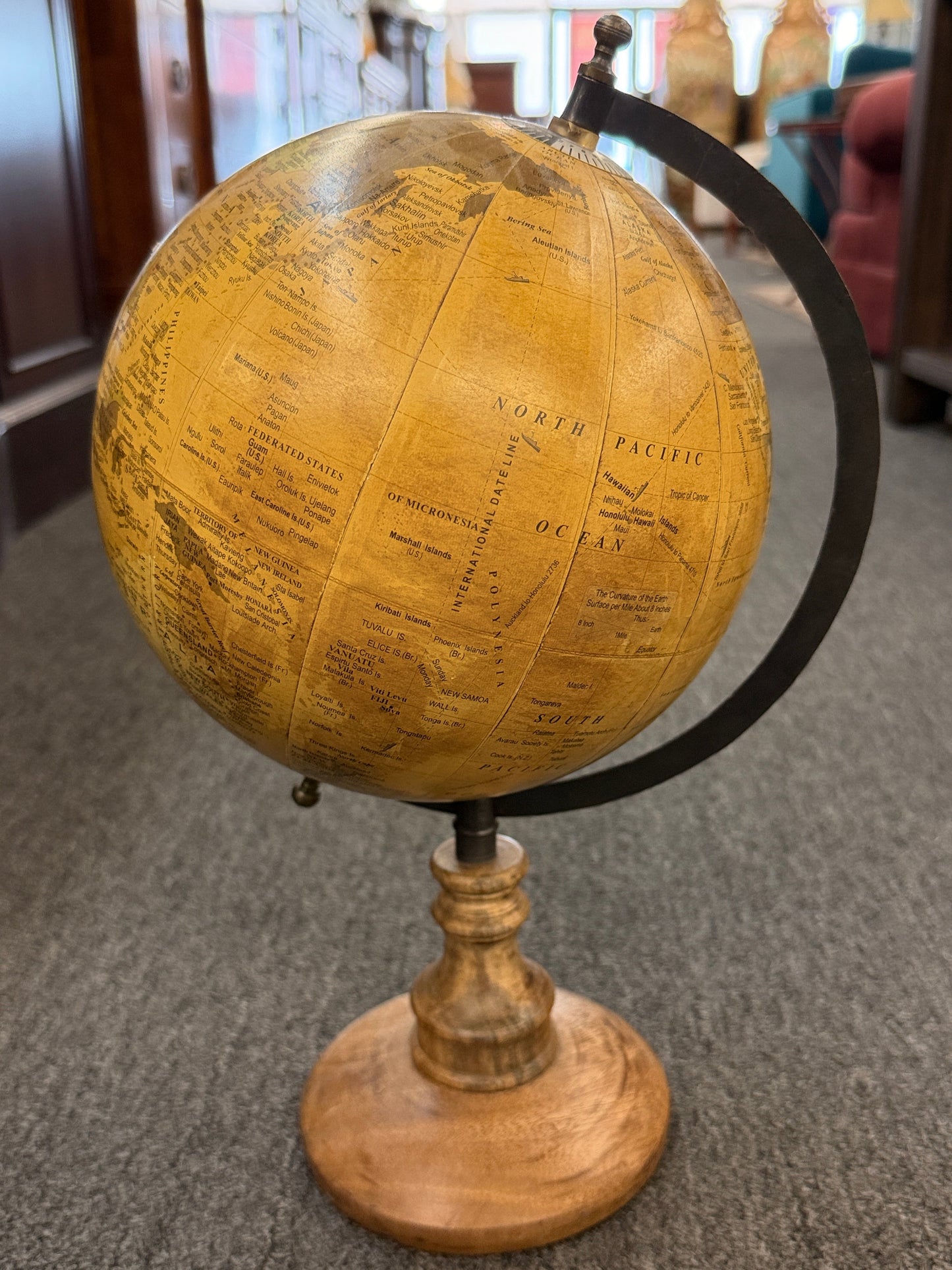 A vintage-inspired 14-inch desktop globe featuring a warm sepia-toned antique map, a dark metal meridian, and a classic turned-wood pedestal base.