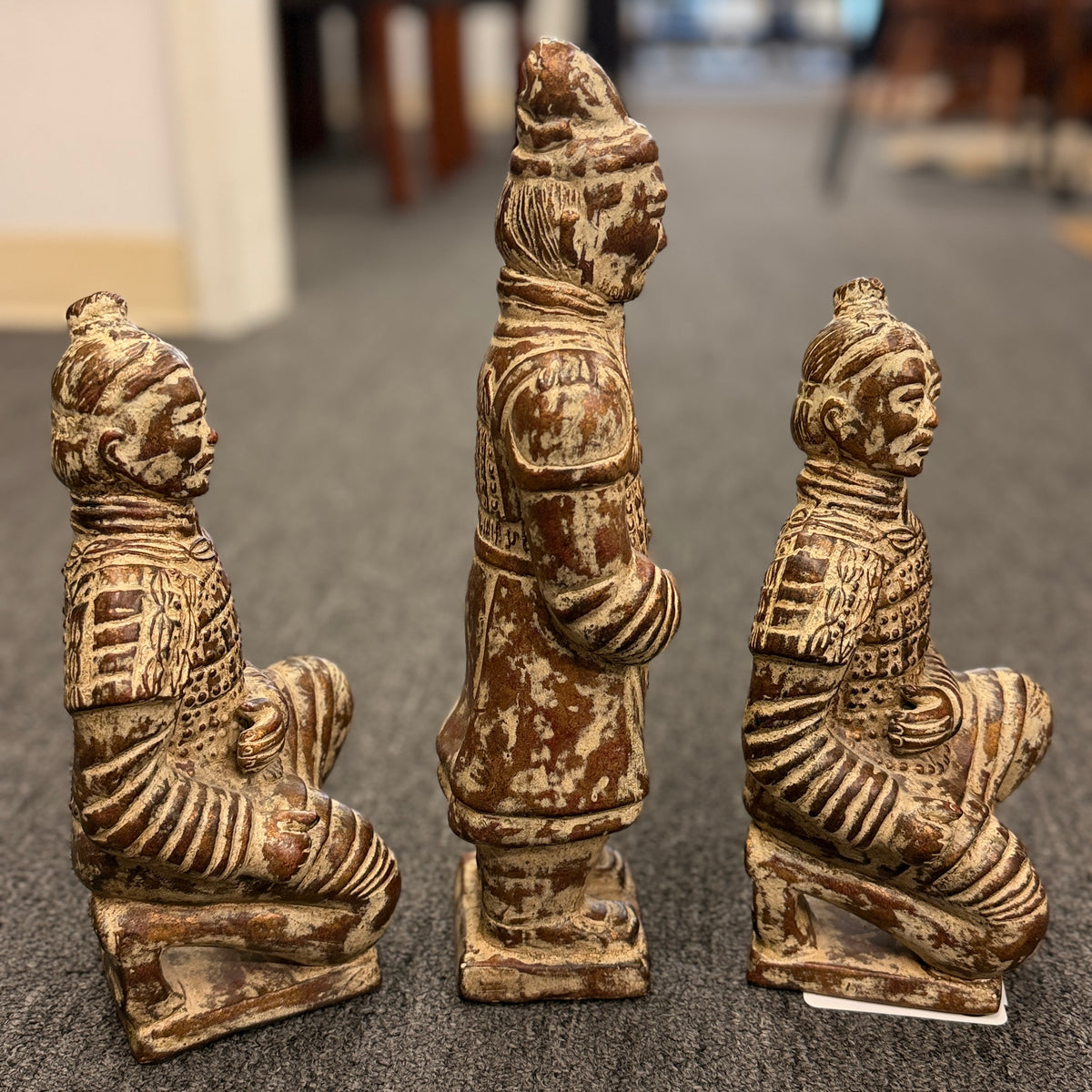 Set of three Terracotta Warrior replica figurines including one standing officer and two kneeling archers finished in a distressed antiqued gilt and terracotta-wash patina in excellent condition.