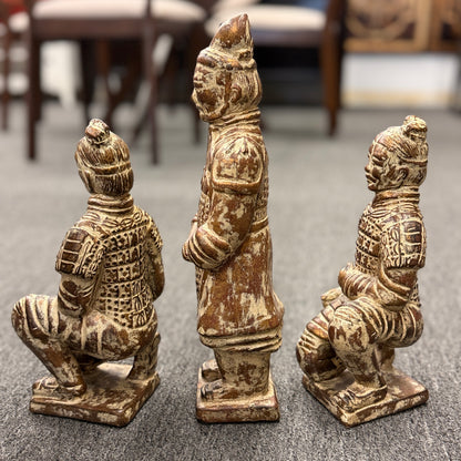 Set of three Terracotta Warrior replica figurines including one standing officer and two kneeling archers finished in a distressed antiqued gilt and terracotta-wash patina in excellent condition.