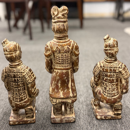 Set of three Terracotta Warrior replica figurines including one standing officer and two kneeling archers finished in a distressed antiqued gilt and terracotta-wash patina in excellent condition.