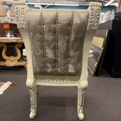Decorative armchair with floral pattern in a store setting