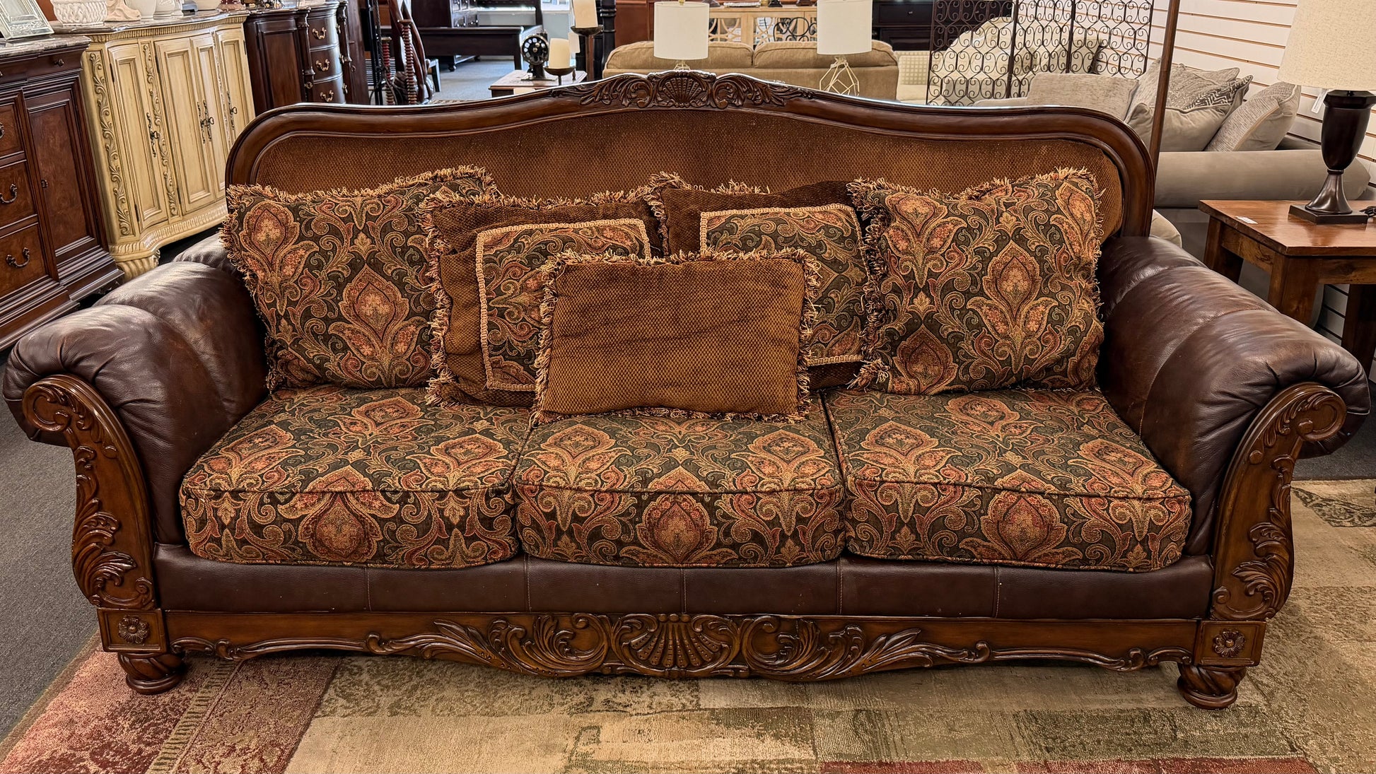 Decorative sofa with patterned cushions in a room setting