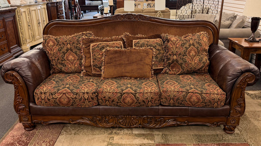 Decorative sofa with patterned cushions in a room setting