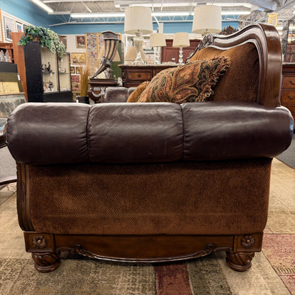 Brown leather sofa in a furniture store setting
