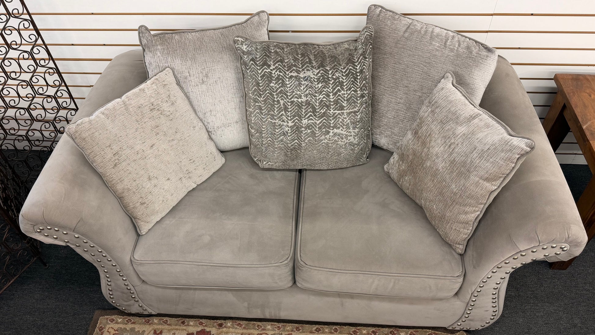 Gray sofa with decorative pillows in a room setting