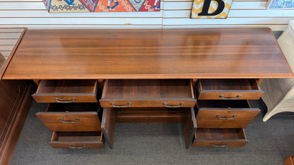 Wooden cabinet with open doors in a room setting