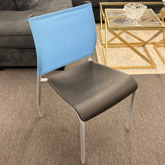 Chair with blue backrest and brown seat in a living room setting