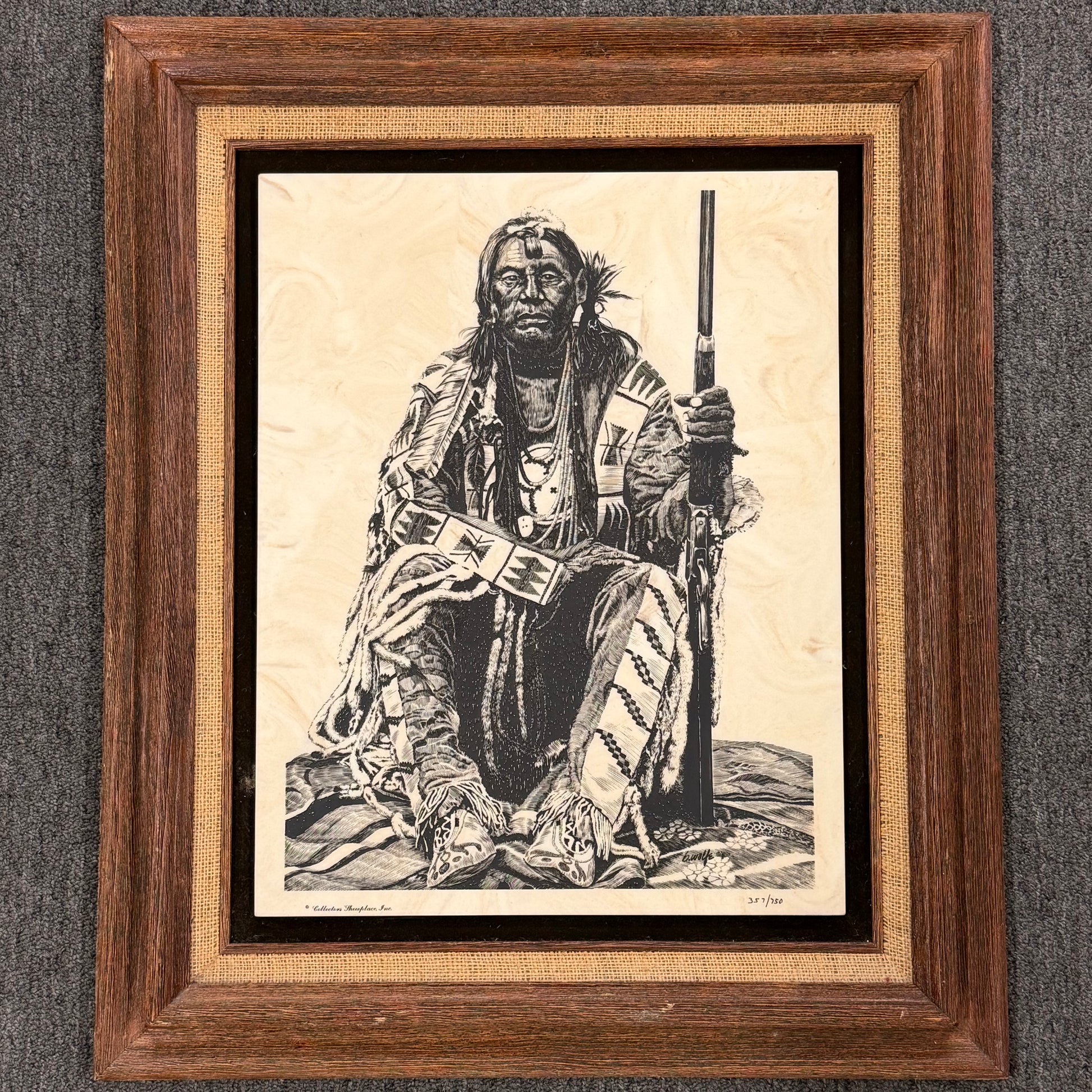 Framed artwork of a Native American figure holding a rifle and a book on a textured gray background
