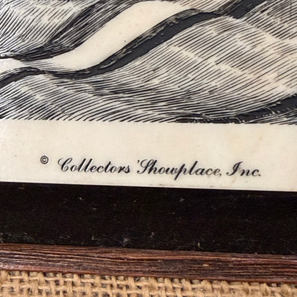 Close-up of a decorative item with wicker base, textured surface, and 'Collectors' Showplace, Inc.' branding.