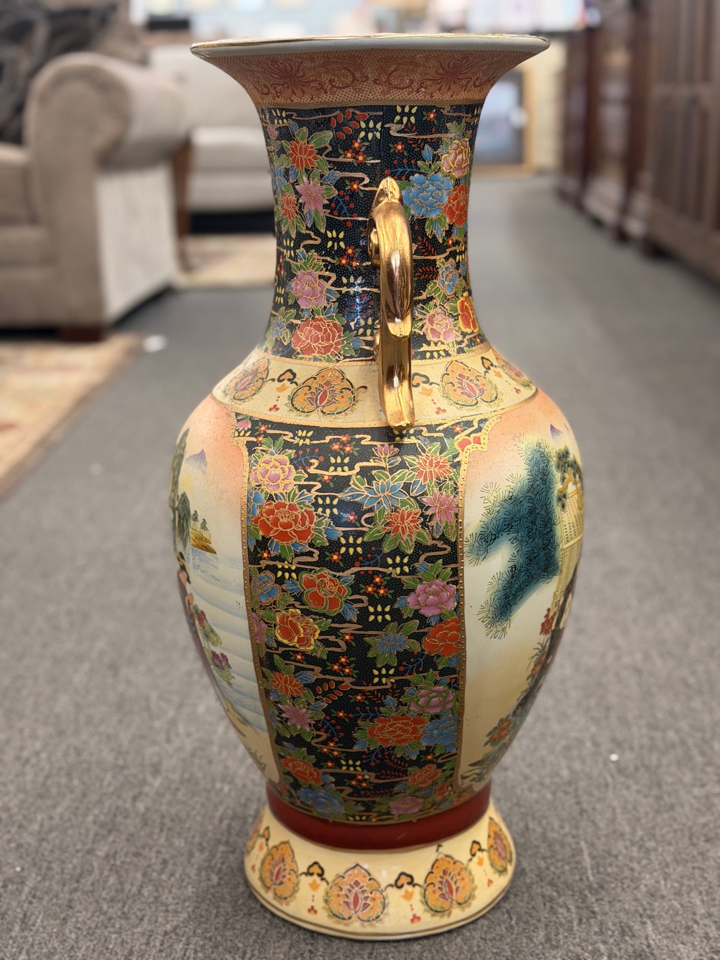 Decorative vase with intricate patterns on a carpeted floor
