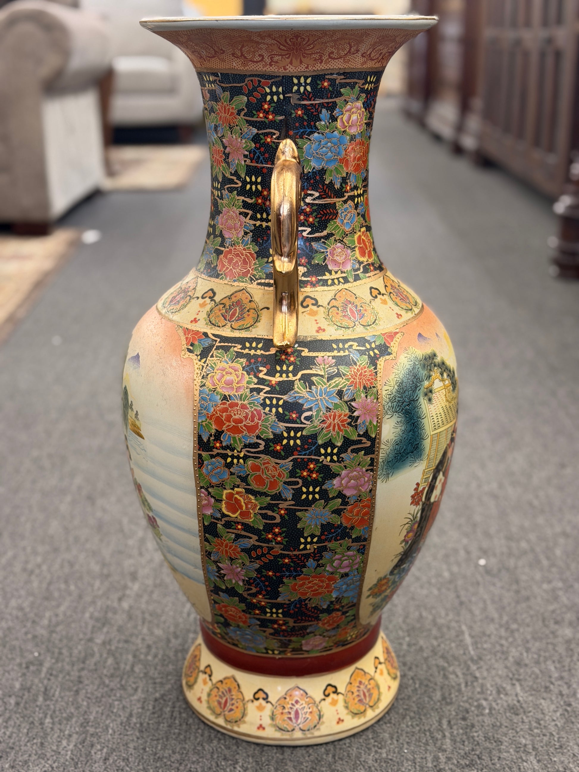 Decorative vase with intricate patterns on a carpeted floor