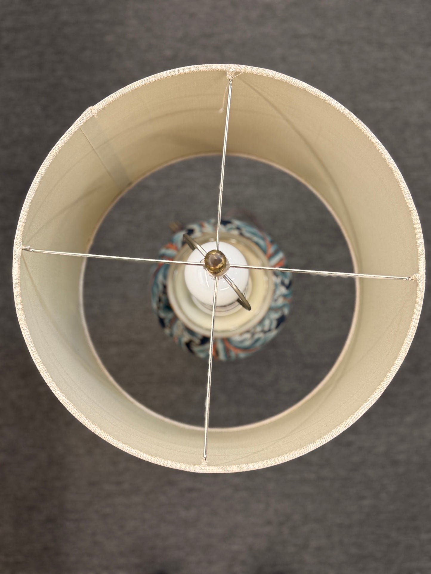 Close-up of a lampshade with a dark background