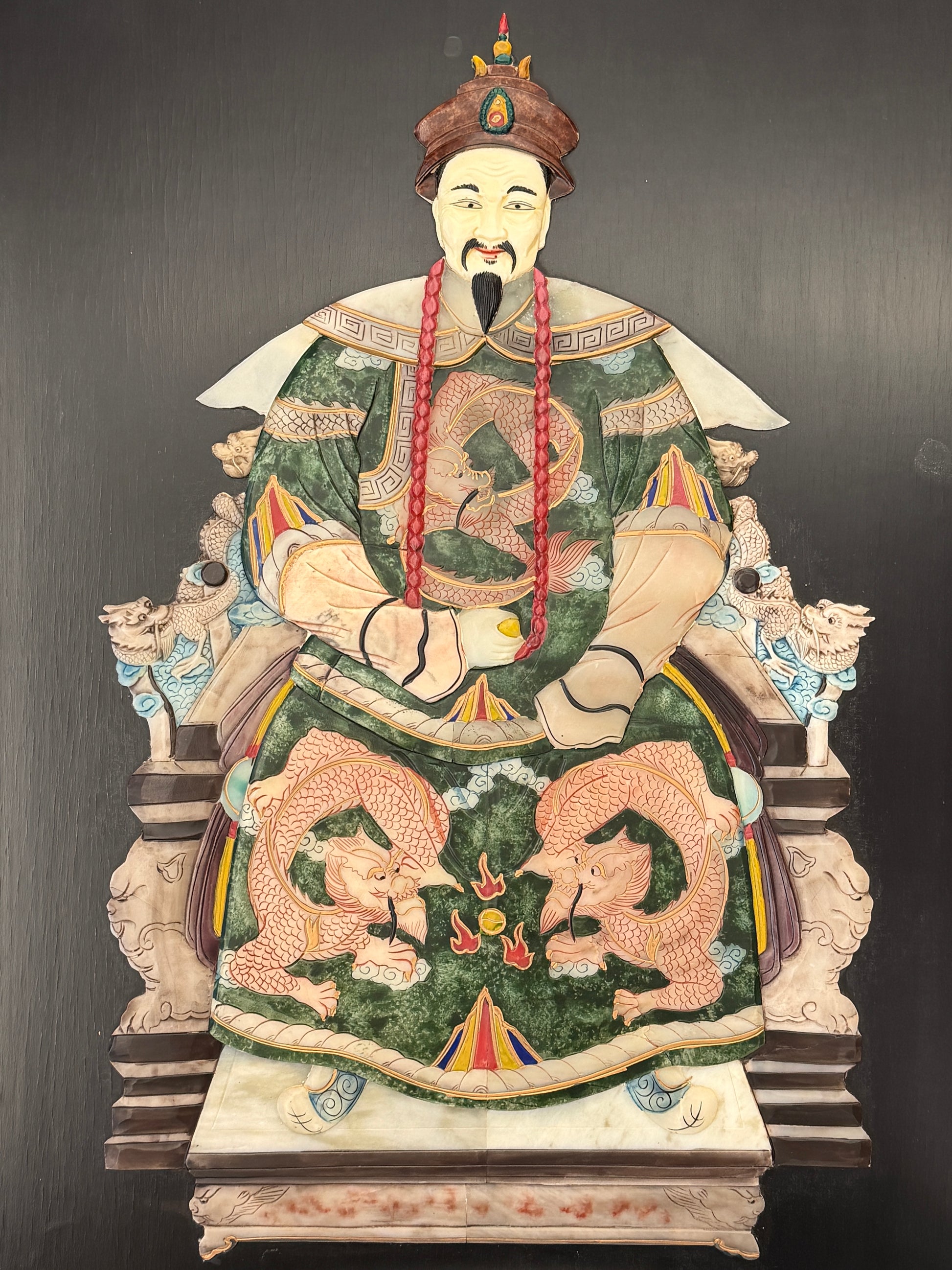 Traditional Asian emperor portrait framed wall art featuring an enthroned figure with green and gold 3D textured accents in a dark wood frame at 2nd Debut Houston consignment showroom