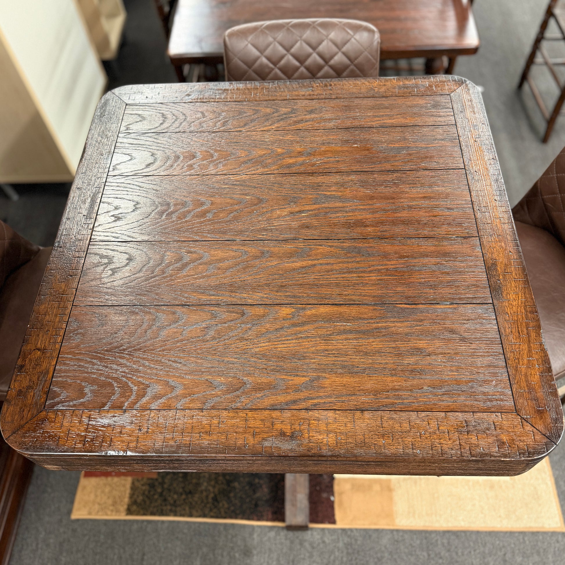 Wooden table with a textured surface in an indoor setting