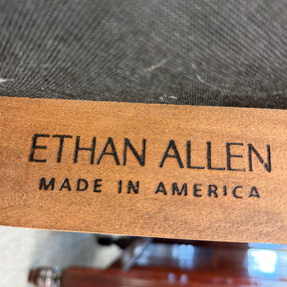 Ethan Allen logo on a wooden product with 'Made in America' text.