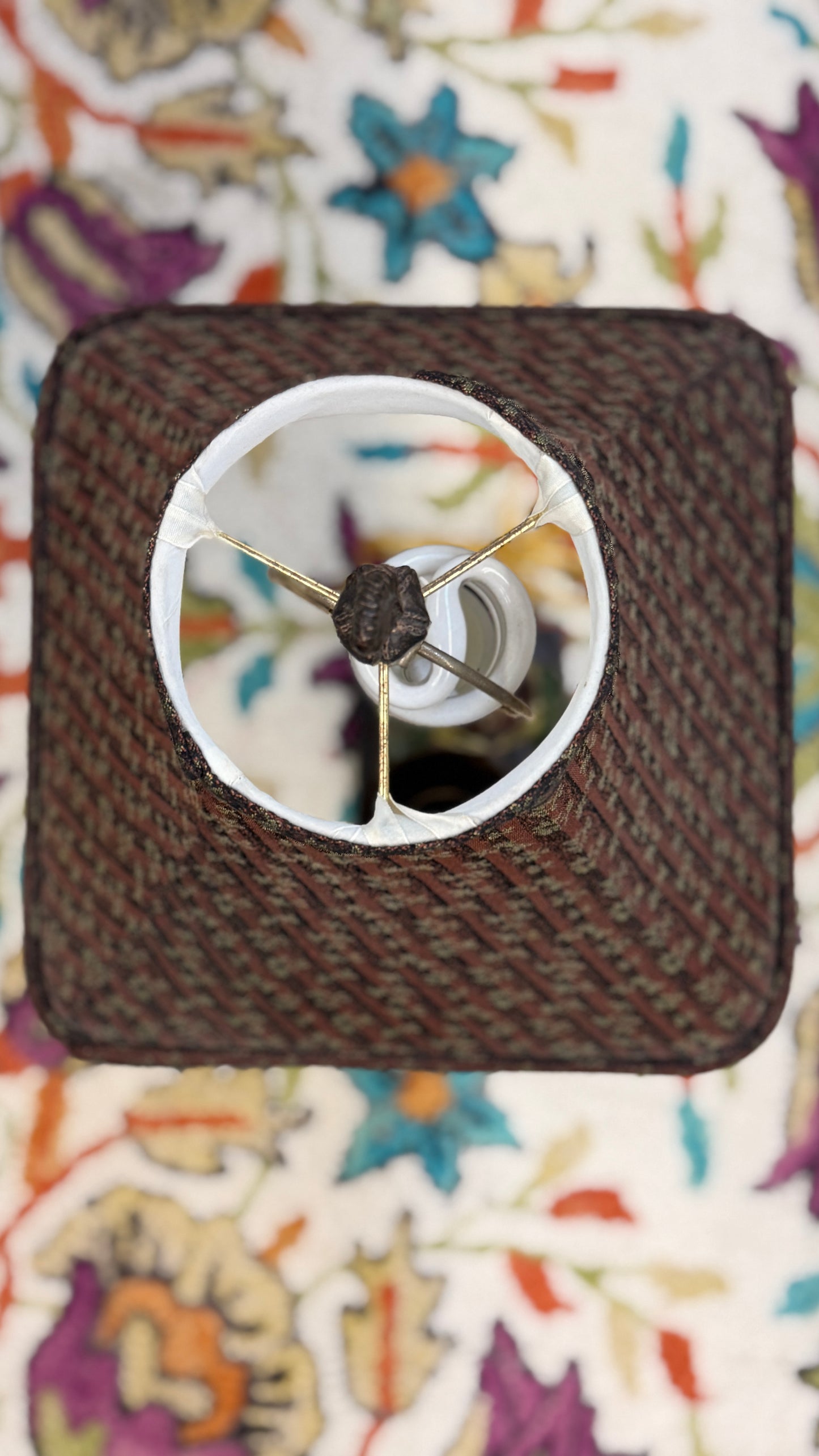 Small blender on a colorful floral background