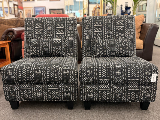 Pair of patterned chairs in a furniture store setting