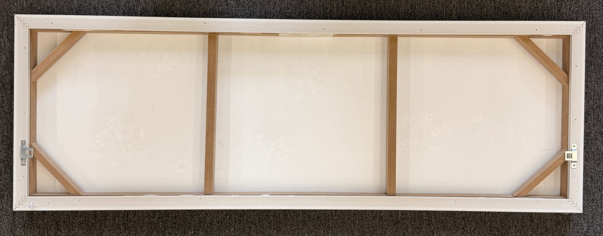 Wooden picture frame with glass on a dark textured background