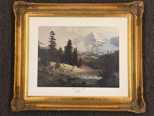 Framed landscape print(Melody of the Maroon Bells) with a gold frame on a dark background