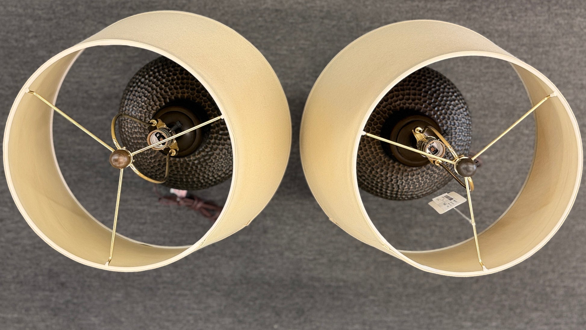 Set of 2 transitional silver quatrefoil trellis cage table lamps with beige fabric shades against a gray background at 2nd Debut Houston consignment showroom