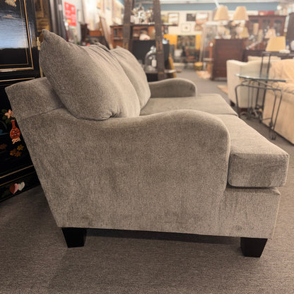 Gray sofa in a furniture store setting