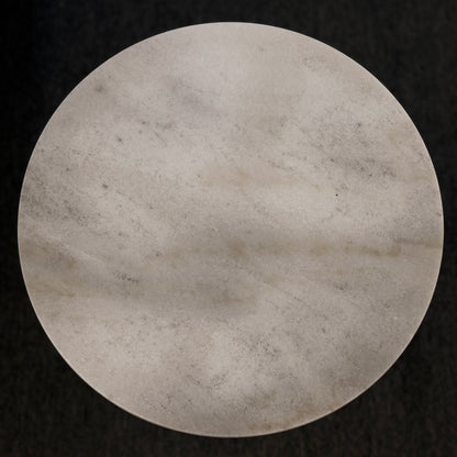 Round stone surface on a black background