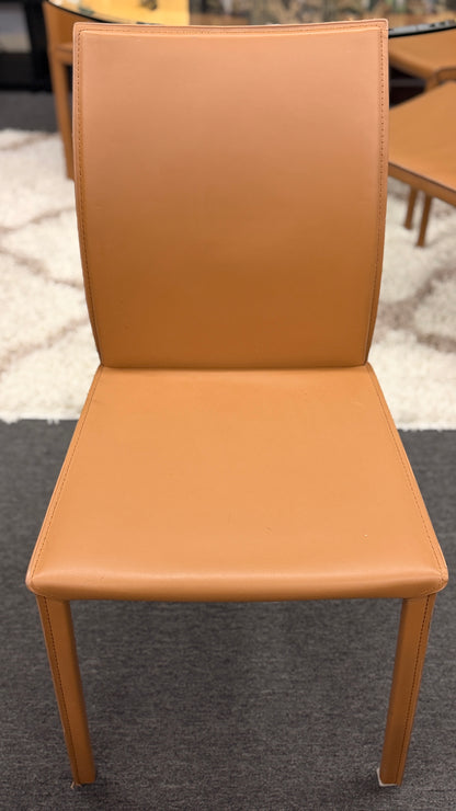 Tan chair on a carpeted floor