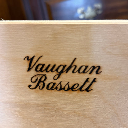 Wooden surface with 'Vaughan Bassett' engraved on it