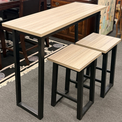 Set of high tables with stools in a room setting