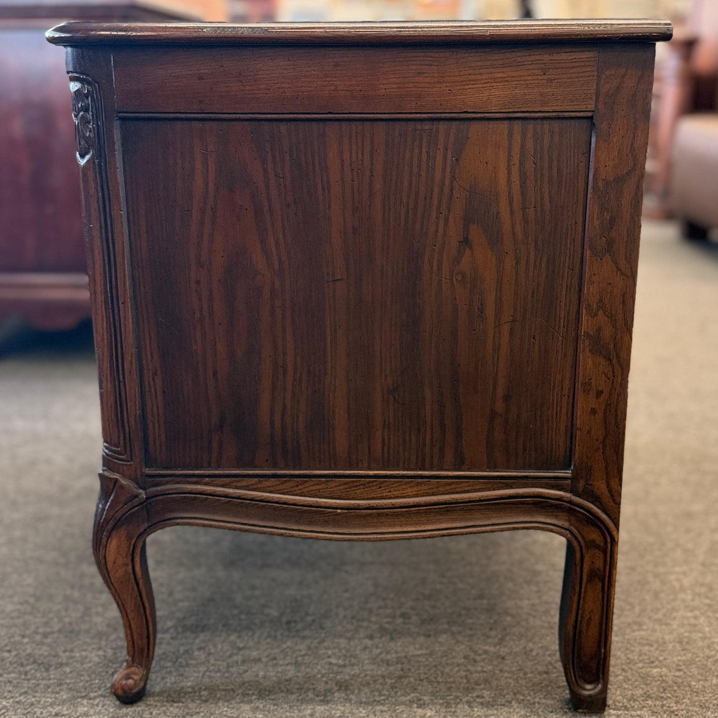 Wooden side table with a dark finish in an indoor setting