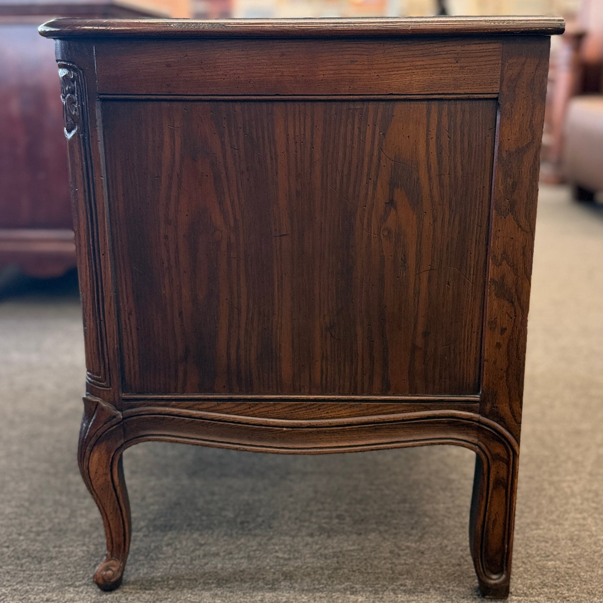 Wooden side table with a dark finish in an indoor setting