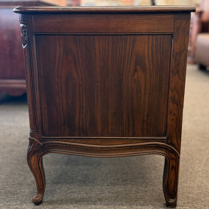Wooden side table with a dark finish in an indoor setting