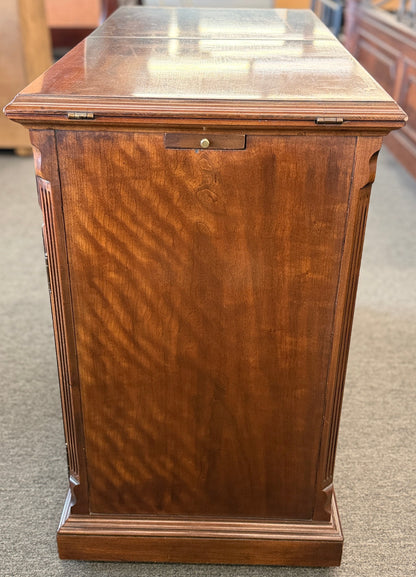 Wooden display case with glass top in a store setting