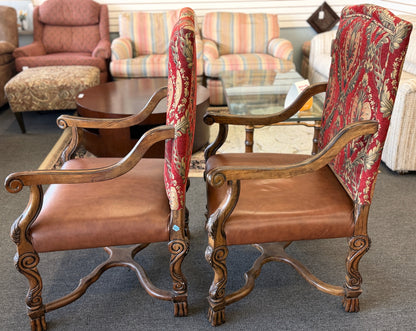 Traditional Gothic carved wood and red tapestry 2pc armchairs with brown leather seats at 2nd Debut Houston consignment showroom