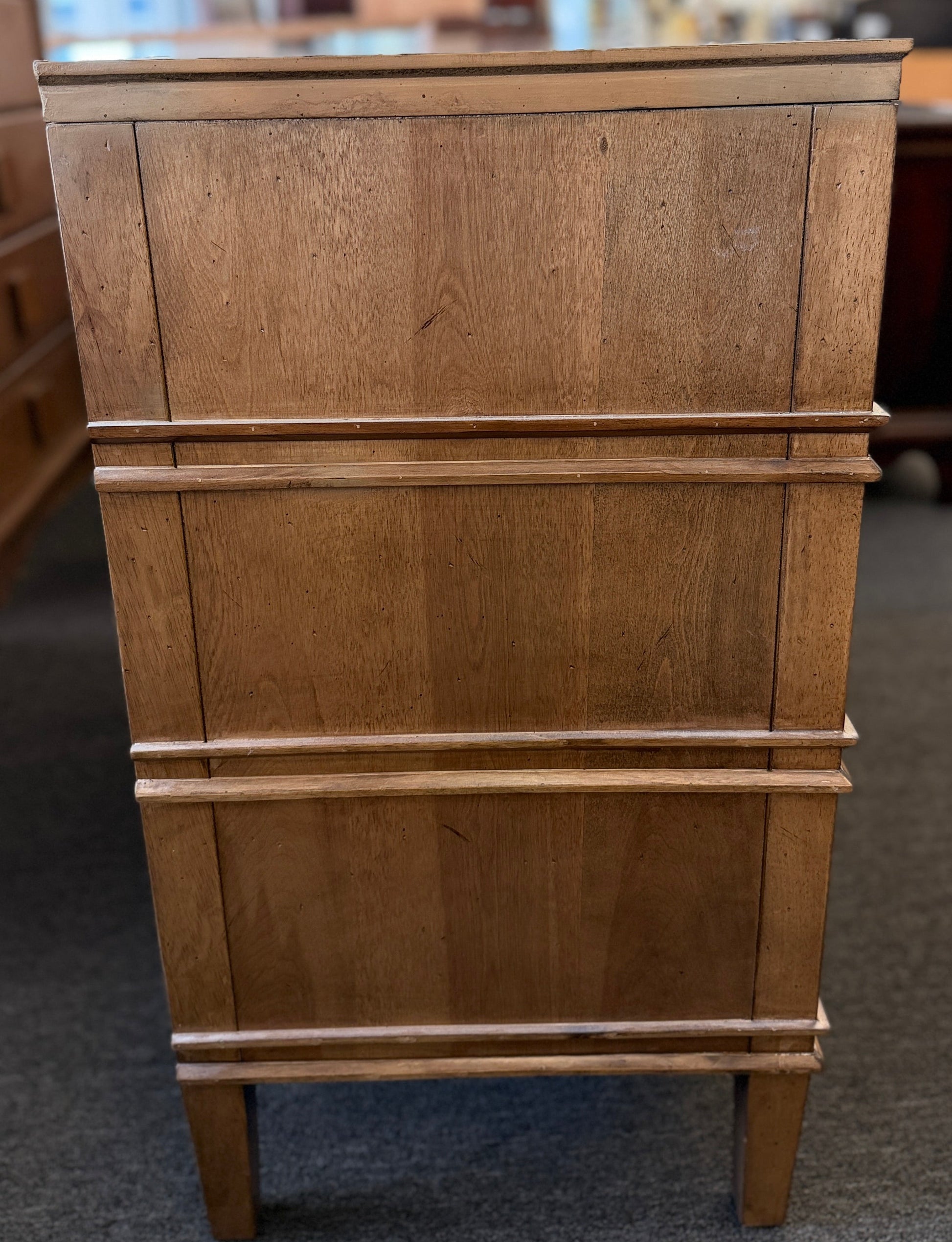 Traditional golden brown wood 6 drawer dresser featuring a unique multi tier layout and drop handles at 2nd Debut Houston consignment showroom