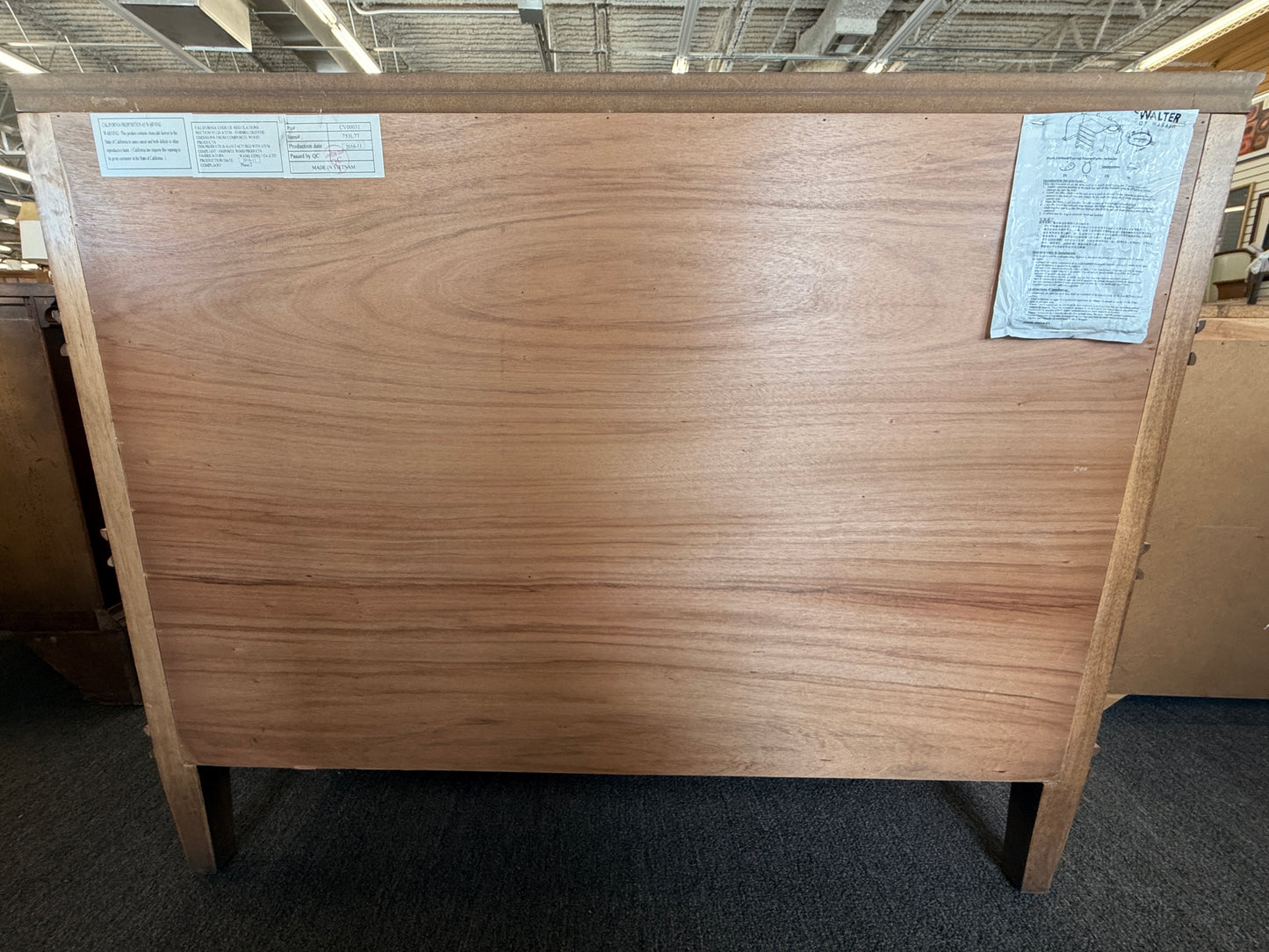 Traditional golden brown wood 6 drawer dresser featuring a unique multi tier layout and drop handles at 2nd Debut Houston consignment showroom