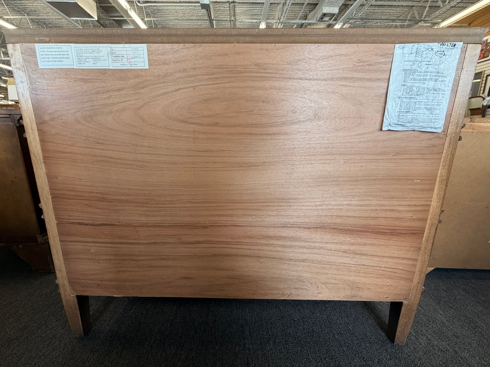 Traditional golden brown wood 6 drawer dresser featuring a unique multi tier layout and drop handles at 2nd Debut Houston consignment showroom