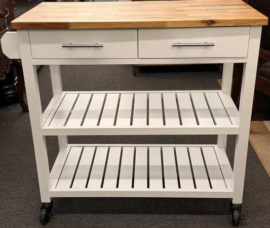 White kitchen cart with wooden top in a room setting