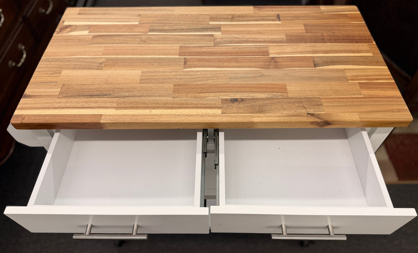 Wooden table with two open drawers underneath