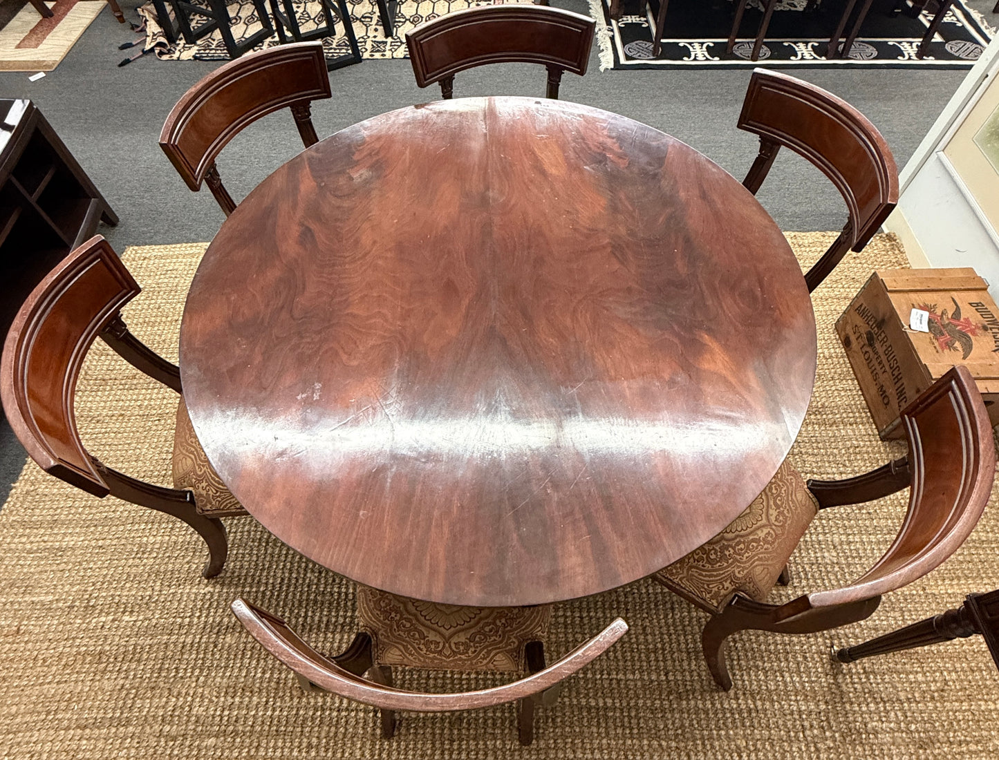 Traditional dark wood round pedestal dining set with 51 inch table and patterned fabric chairs at 2nd Debut Houston consignment showroom