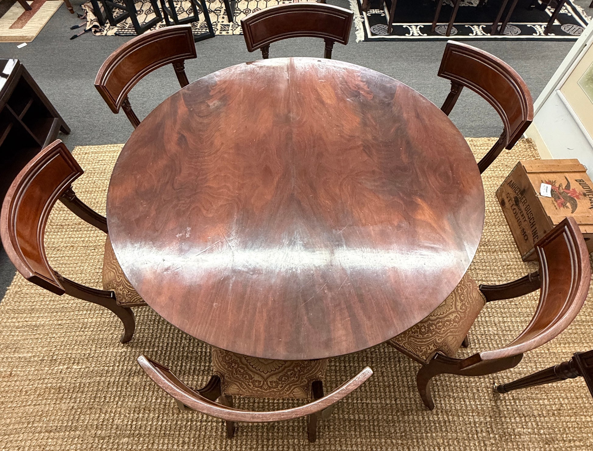 Traditional dark wood round pedestal dining set with 51 inch table and patterned fabric chairs at 2nd Debut Houston consignment showroom