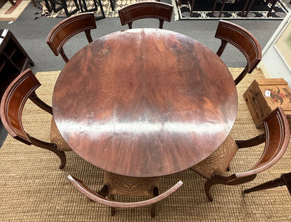 Traditional dark wood round pedestal dining set with 51 inch table and patterned fabric chairs at 2nd Debut Houston consignment showroom