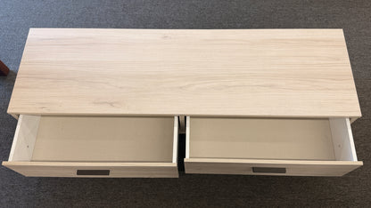 A contemporary, low-profile 53-inch TV stand with two wide drawers, sleek black bar pull handles, and a slim black metal base frame.