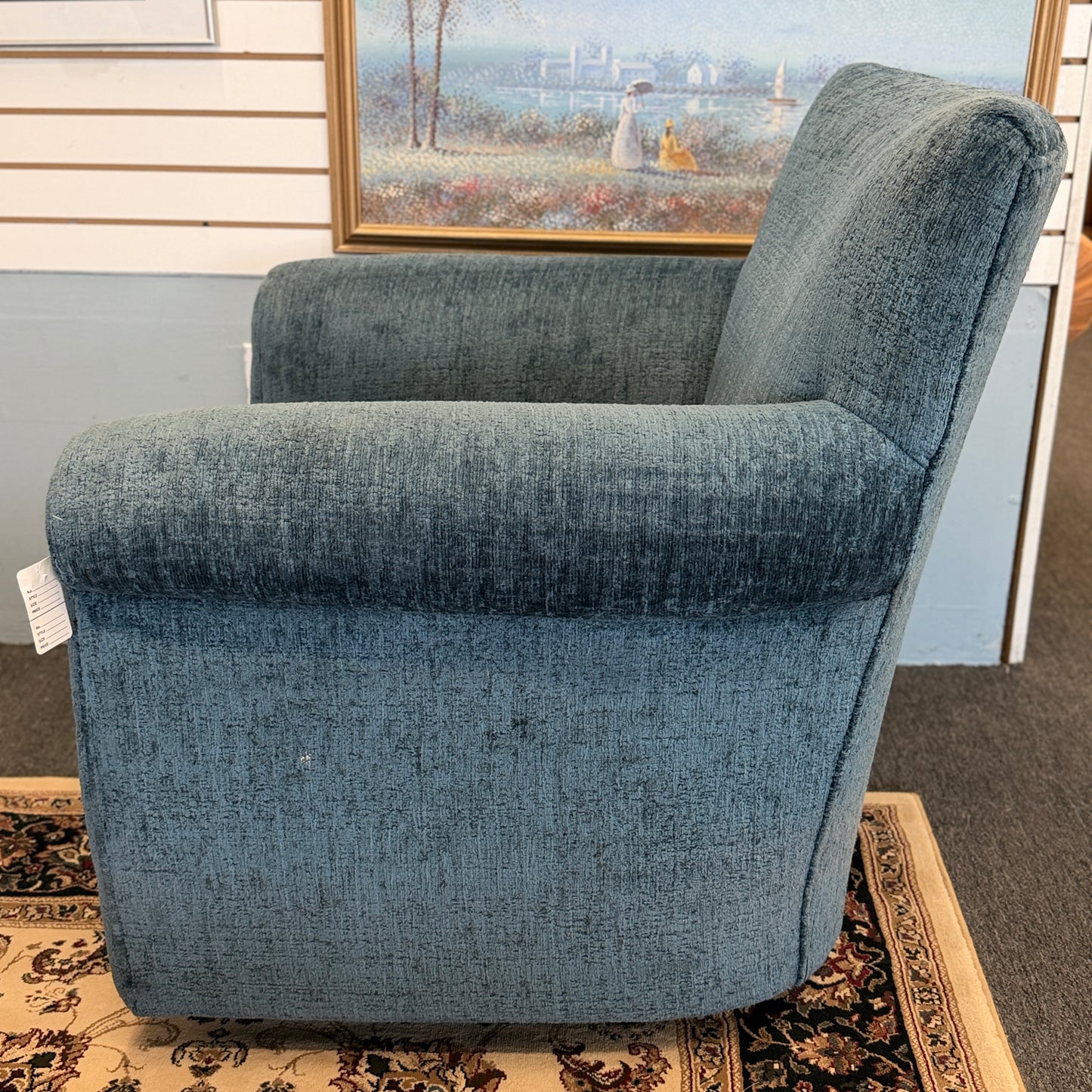 A premium Arhaus plush upholstered swivel armchair in excellent condition, featuring rolled arms, a thick seat cushion, and a high backrest.