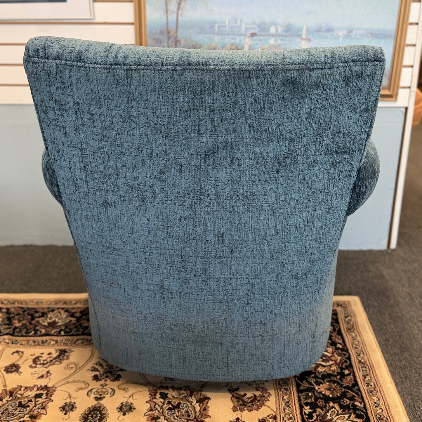 A premium Arhaus plush upholstered swivel armchair in excellent condition, featuring rolled arms, a thick seat cushion, and a high backrest.
