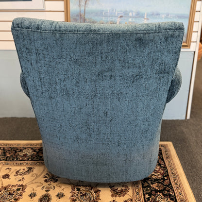 A premium Arhaus plush upholstered swivel armchair in excellent condition, featuring rolled arms, a thick seat cushion, and a high backrest.