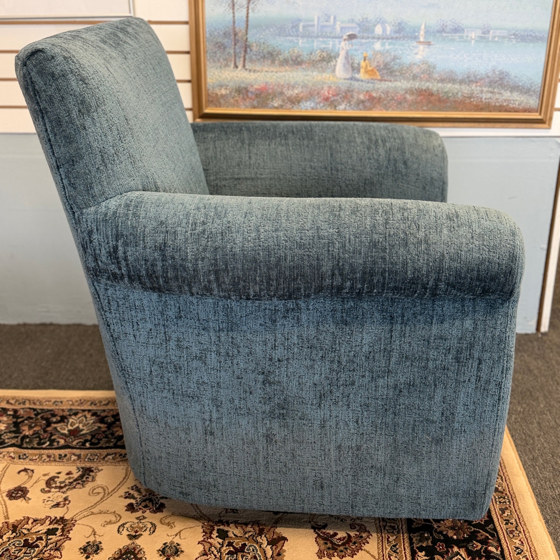 A premium Arhaus plush upholstered swivel armchair in excellent condition, featuring rolled arms, a thick seat cushion, and a high backrest.