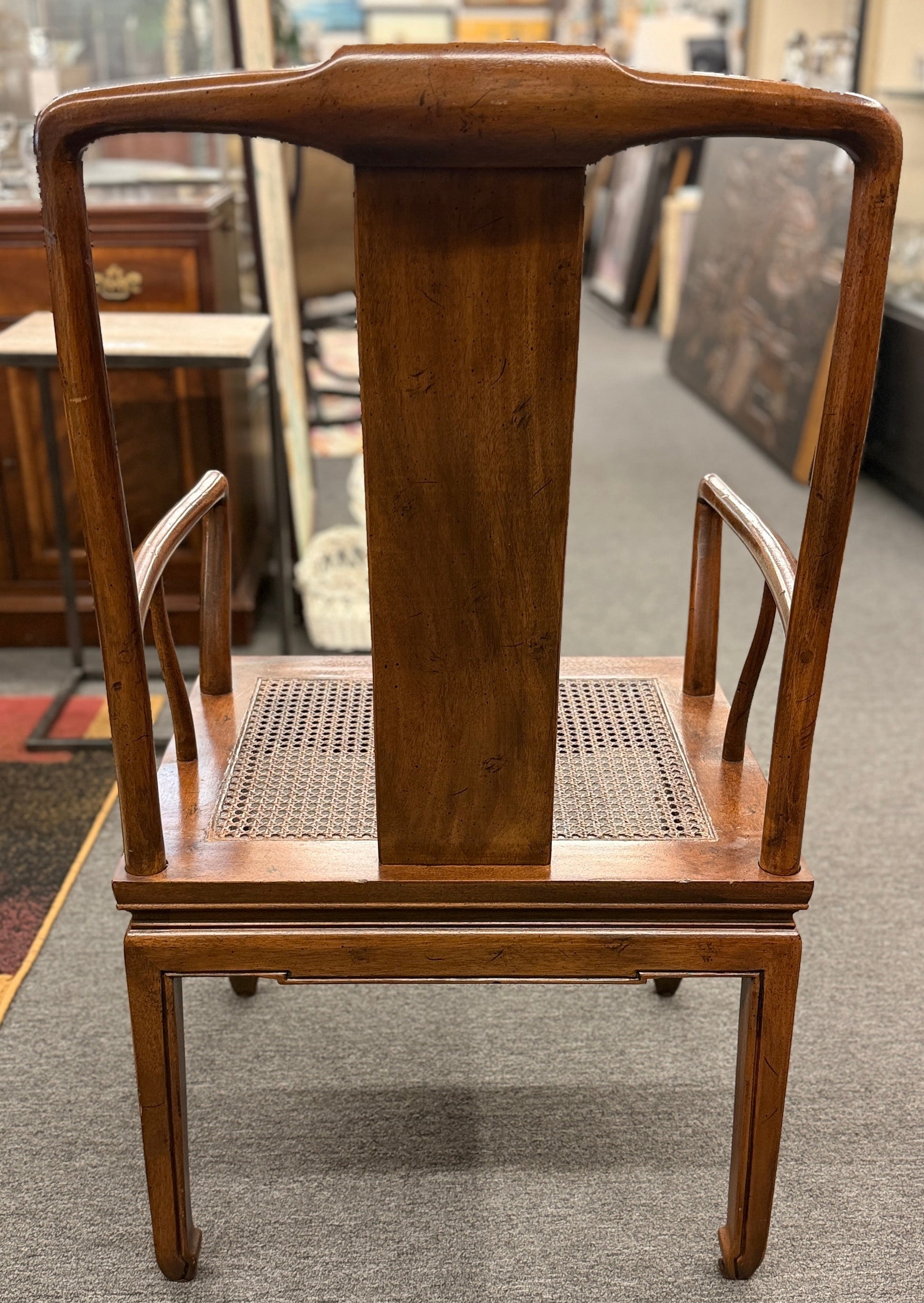 A 9-piece traditional wooden dining set featuring a large rectangular table, two matching armchairs, and six side chairs with woven rattan backrests.