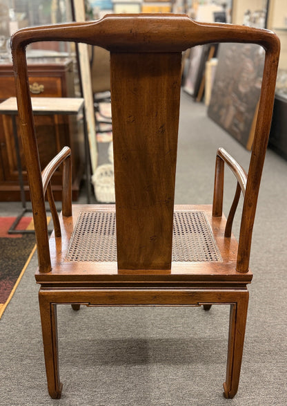 A 9-piece traditional wooden dining set featuring a large rectangular table, two matching armchairs, and six side chairs with woven rattan backrests.
